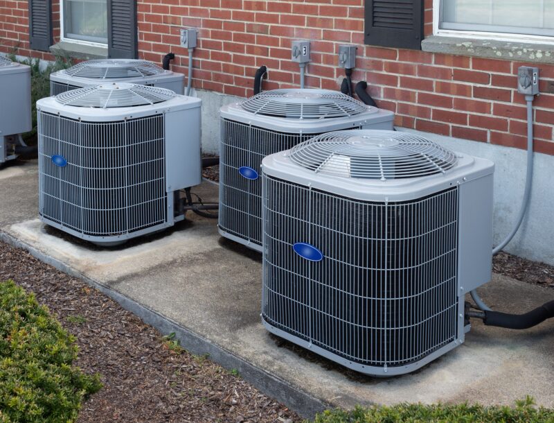 group of outdoor hvac units outside of residence