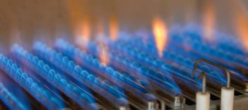 closeup of blue flames on a furnace