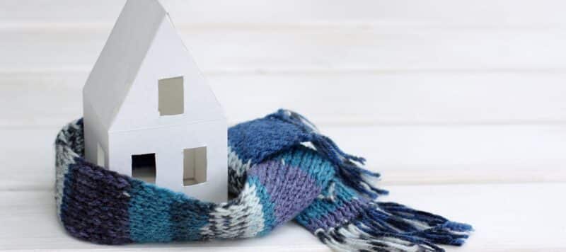 paper house covered by a winter scarf
